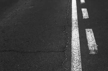 Fototapeta premium Double white line on asphalt road.