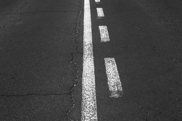 Double white line on asphalt road.