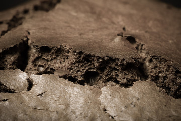 Texture of chocolate cake for edible background. Toned