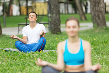 Fototapeta premium Having yoga practice in park