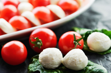 mozzarella cheese balls, ripe cherry tomatoes and caprese salad
