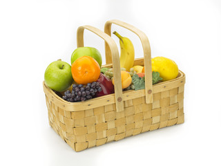 tasty summer fruits in backet isolated on white