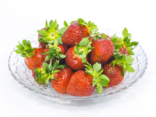 fresh whole strawberries glass plate