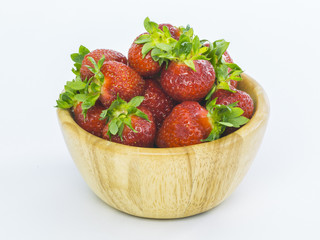fresh whole strawberries in wooden bowl