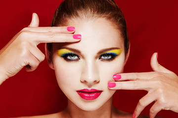 Beautiful colorful makeup. Perfect skin, red lips and manicured nails. sexy eyes. 