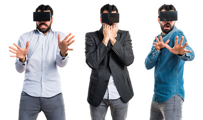 Frightened man using VR glasses