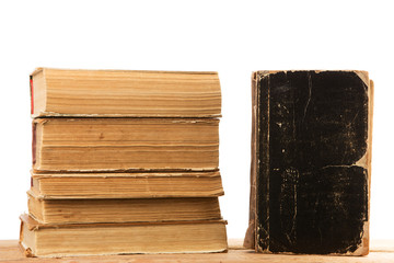 Stack of old and used hardback books or text books  isolated