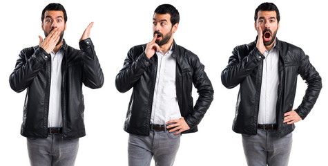 Man with leather jacket doing surprise gesture