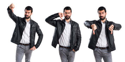 Man with leather jacket doing bad signal