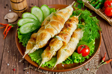 Kebab with tomatoes and cheese in pastry