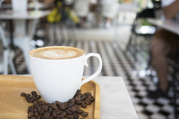 Cup of coffee put on table in cafe