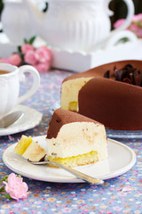 Elegant chocolate souffle cake covered with chocolate velor, with lemon confit.
