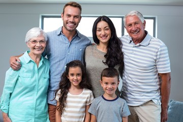 Obraz premium Happy family standing together and smiling