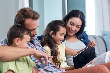 Parents sitting with son and daughter 