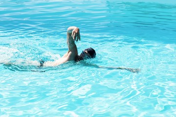 Fit swimmer doing the front crawl