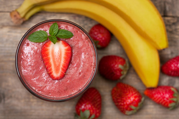 smoothie with banana and strawberry in the glass