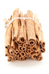 Top front view of Raw Organic Cinnamon sticks (Cinnamomum verum) bundle tied up with thread.