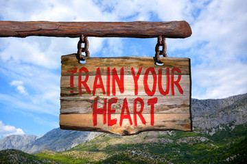 Fototapeta premium Train your heart motivational phrase sign