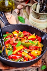 Italian cuisine, peperonata: roasted bell pepper with capers and basil