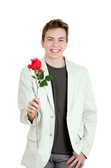 Valentines day. Portrait of young man holding the rose over the white background