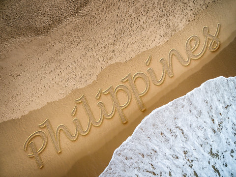 Philippines written on the beach