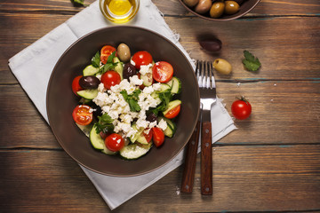 Traditional greek salad with fresh vegetables, feta cheese and olives