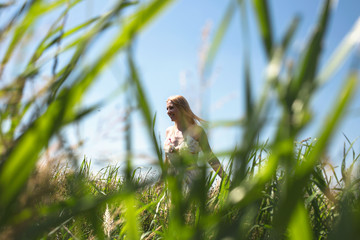 happy woman walking in a field