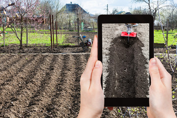 farmer photographs the plowing of garden ground
