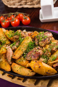 meat with potatoes in pen