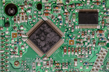 Close-up shot of an old and used integrated circuit board 