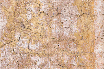 Background of old yellow brown white painted wall