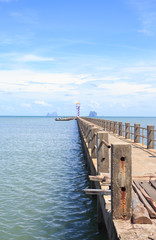 Obraz premium old wooden and concrete bridge in tranquil sea to find paradise destination way,Trang Thailand
