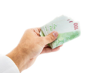 hand giving 100 euro banknotes isolated on white