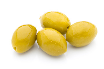 Olives on leaves isolated on white.