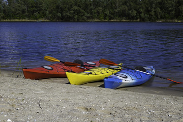  Colourful kayaks on the beach 