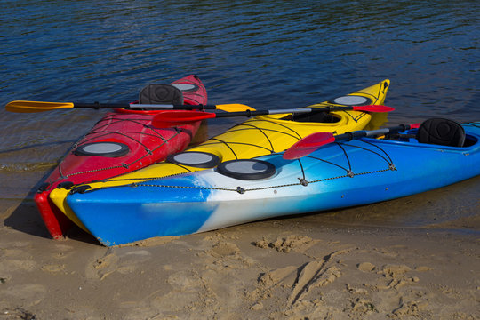  Colourful kayaks on the beach 