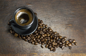 Cup of hot coffee on wooden background