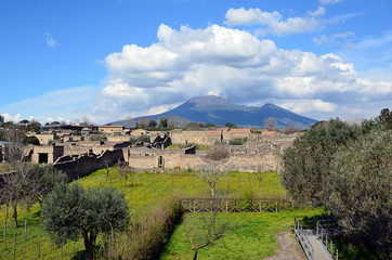 Fototapeta na wymiar Vesuvius volcano cloudy sky view from pompei city excavation