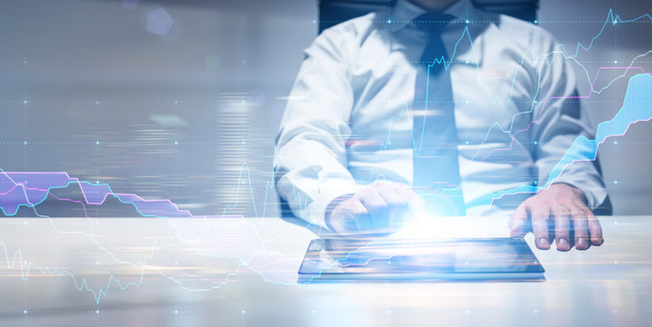 Man using tablet with business graph