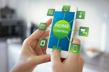 Using smart home app on phone. Smart home control concept.