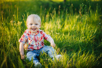 child sitting on the grass