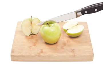 knife slicing green apples
