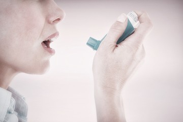 Composite image of close up of a woman using an asthma inhaler - obrazy, fototapety, plakaty