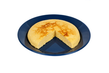 Isolated backed pot cheese pie on blue plate.