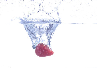 strawberry falling on water