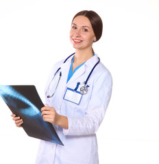 Happy smiling young beautiful female doctor showing blank area for sign or copyspace, isolated over white background