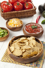 nachos on wooden bowl
