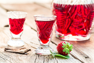 Homemade liqueur made of alcohol and strawberries