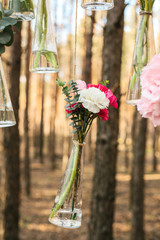 Wedding flowers decoration arch in the forest. The idea of a wedding flower decoration. wedding concept in nature.
