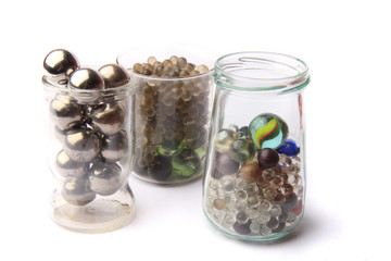 small glass and metal spheres